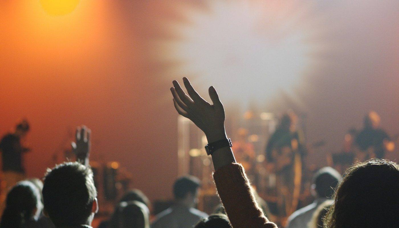 Hand in air at music concert