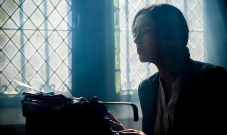 Woman Writing on Typewriter