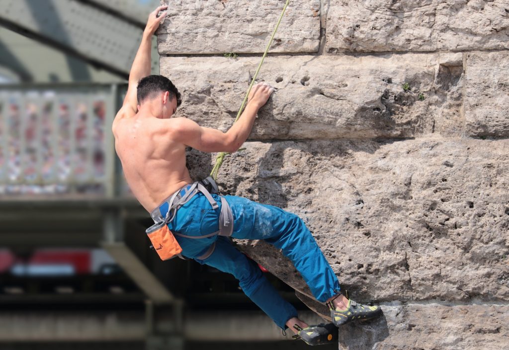 Shirtless rock climber