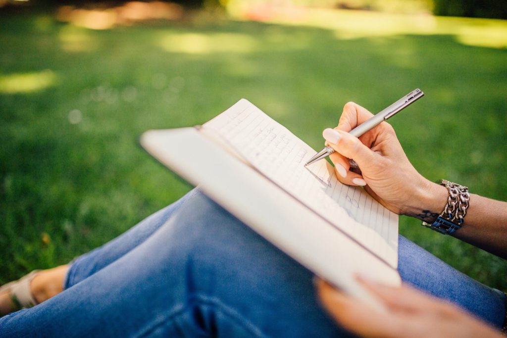 Handwriting in notebook outside