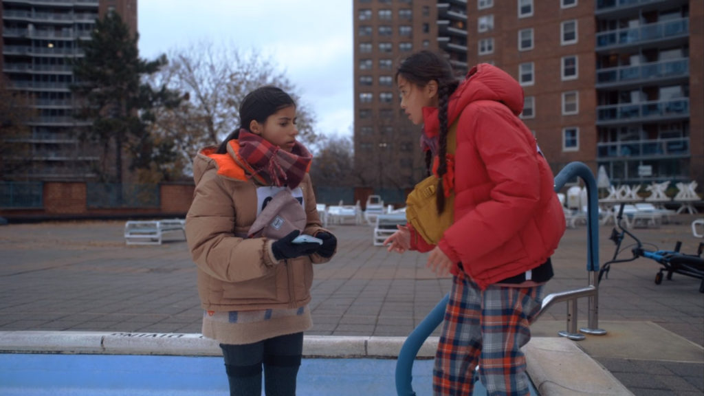 Girls geocaching in Brooklyn, NYC.  Screenshot from Finding 'Ohana movie.