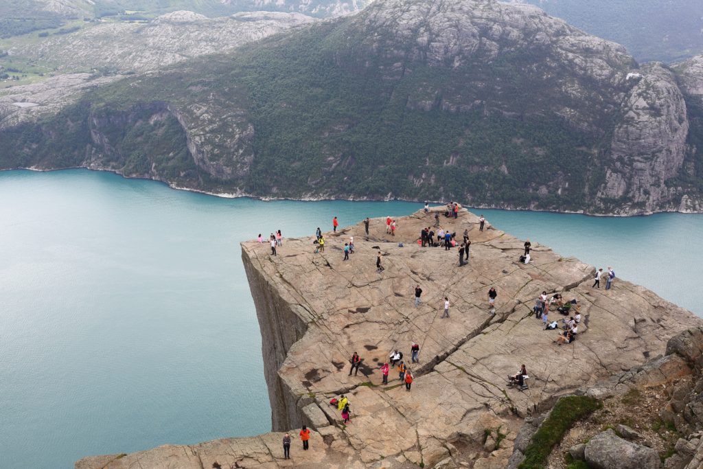 Hiking at top of Puplit Rock in Norway