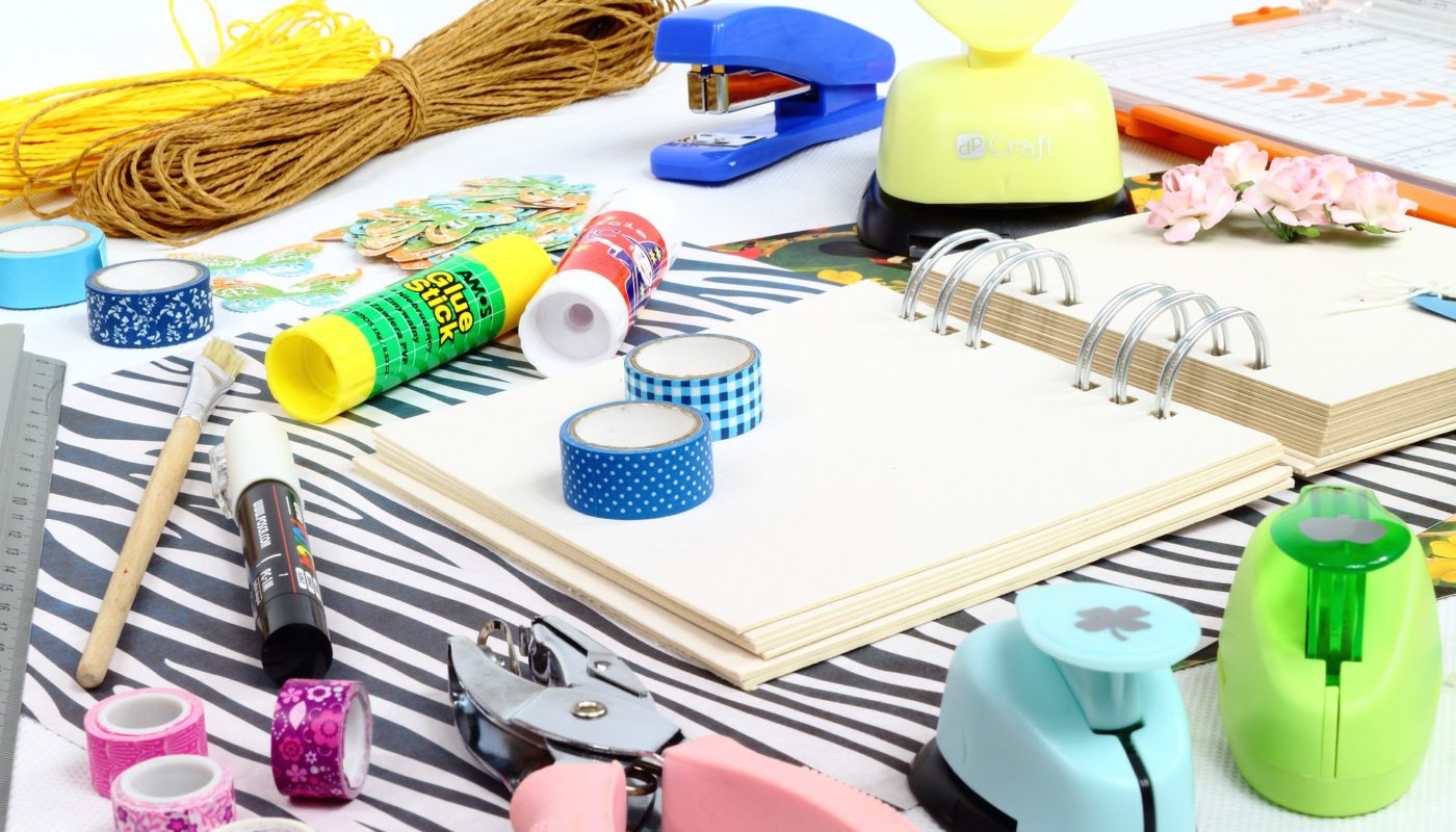 Scrabooking supplies on table