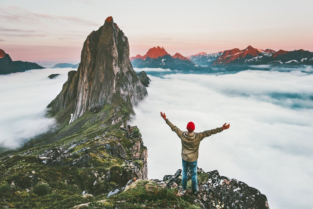 Man with arms raised at Selga in Norway