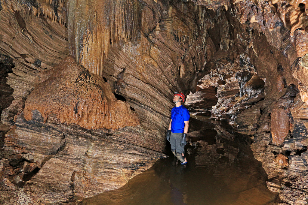 Man standing in Glowing Abbey Caves