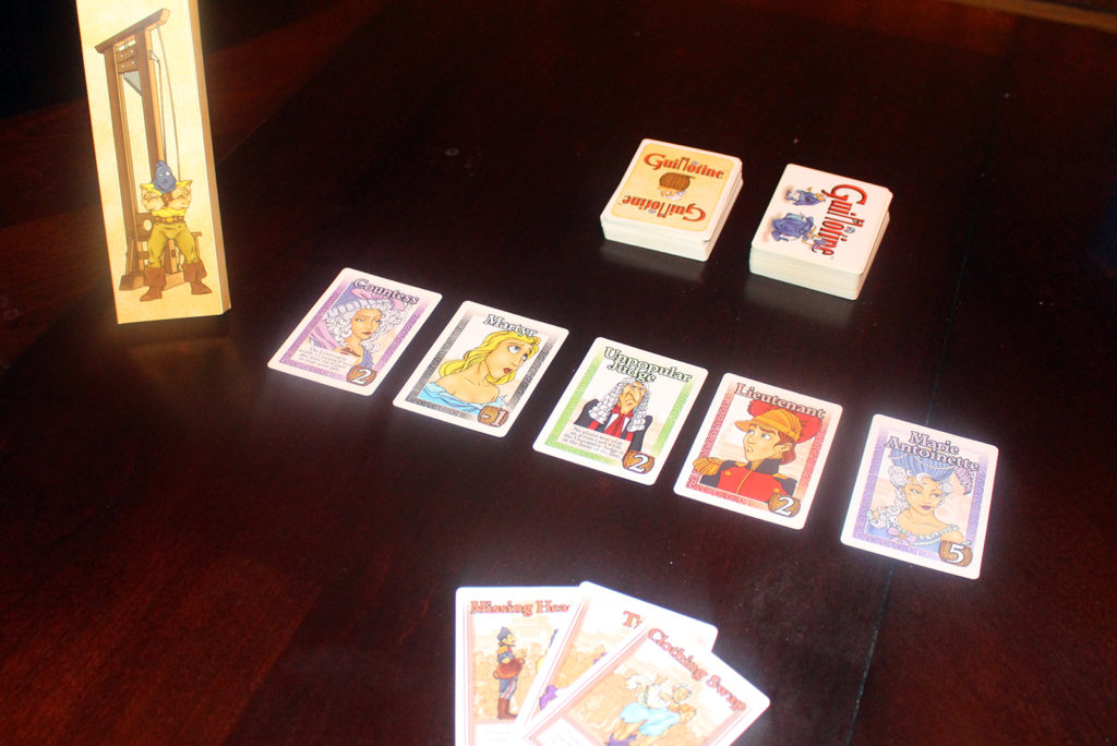 Guillotine card game on table